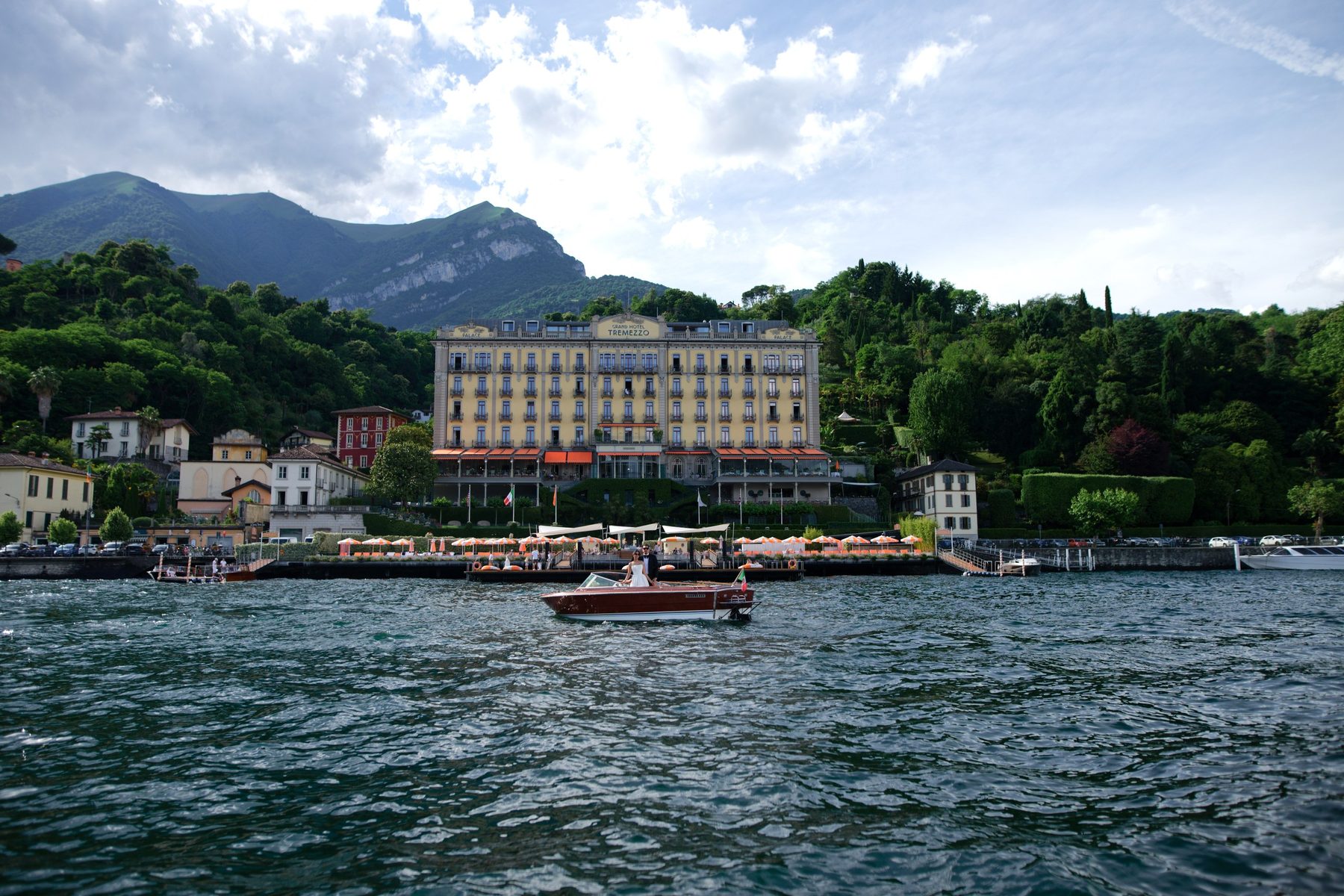 The Grand Hotel on the Bellagio shore of Lake Como, a Riva passing in front