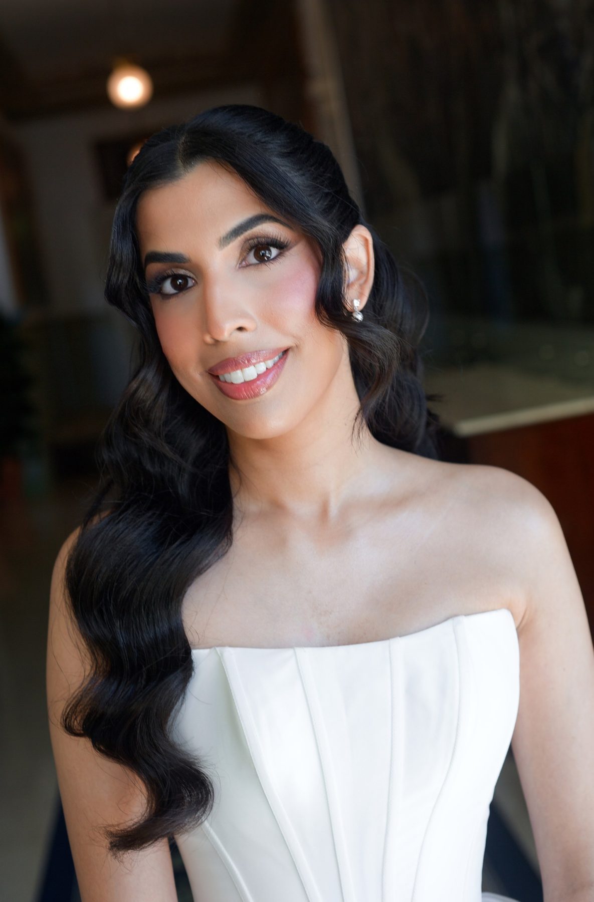 The bride before the ceremony, in a strapless ivory gown